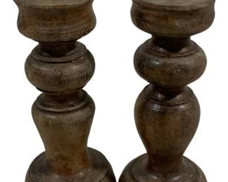 2388 - Pair Wood Candleholders 7" (Description): A set of two candleholders measuring 7 inches tall. Each holder features a turned design with a metal pricket spike at the top for securing candles.