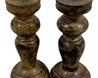 2384 - Pair Wood Candleholders 7" (Description): A two-piece set of candleholders measuring 7 inches in height. These turned wood pricket-style candleholders feature a baluster form with circular bases and metal spike tops for securing candles. The pieces display a weathered, aged patina throughout.