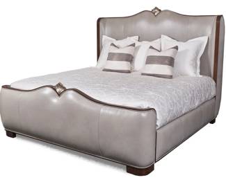 7015 - Alden Home Oceana King Bed (Description): A cresting ocean wave is captured in the hand-carved accents of the Oceana King Bed. The front and back of the headboard and footboard and the side rails are meticulously upholstered, permitting this piece to float in a spacious master bedroom. The carved accents are finished in Champagne Leaf. Bedding and mattressin photo not included, selling headboard, footboard & rails only. 66 x 85 x 90