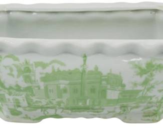 107 - Green & White Porcelain Planter 4.5"x12"x6" (Description): Green and white porcelain planter featuring a transferware-style scenic landscape design depicting architectural structures, trees, and foliage. The rectangular vessel has a scalloped rim edge and twisted rope-style handles on each end. Footed basewith matching scalloped detailing. Measures 4.5"x12"x6".