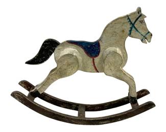 2395 - Rocking Horse 8"x14"x4" (Description): Decorative rocking horse statue featuring a painted design. The piece measures 8 inches high by 14 inches long by 4 inches deep.