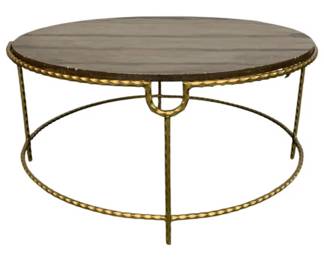 4240 - Furniture Classics Erabella Coffee Table (Description): Retail $1506, 19 x 39, The Erabella Coffee Table by Furniture Classics brings a modern, jewelry-inspired look to your living space with a striking mix of natural stone and warm metal. A solid bluestone top adds rich color and one-of-a-kind character, while the crimped iron base creates an eye-catching, sculptural frame finished in satin gold. Designed as a true focal point, this coffee