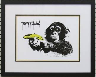9017 - Monkey with Banana Gun by Banksy (Description): 21 X 17.5