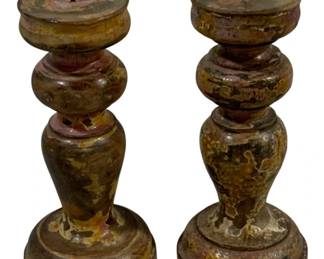 2398 - Pair Wood Candleholders 7" Tall (Description): A pair of candleholders measuring 7 inches tall. These turned wood pricket-style candleholders feature worn painted surfaces revealing layers of color beneath. Each has a metal spike at the top for securing candles.