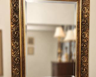 Large, ornate, all wood, beveled miror w/gilt finish