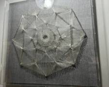 Metal and string wall art