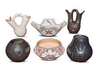 1075 Six Pueblo pottery vessels Second half 20th century Comprising: Santa Clara blackware: Linda Howard Naranjo (20th century) A wedding jar with incised bear claw Alvin Baca (b. 1966) A jar incised with bear paws Phyllis Tafoya (b. 1955) A melon jar incised with bear paw motif Quanita Kalestewa (b. 1932, Zuni) A polychrome heartline deer bowl Jack Kalestewa (b. 1929, Zuni) A polychrome frog and snake effigy bowl A Laguna Pueblo white slip wedding vase incised with bear paw Each variously signed for the artist, the undeciphered reading: A.P. / Laguna 6 pieces Height of tallest 7 1/2 in., width 5 7/8 in., depth 4 1/8 in; height of low bowl 3 1/4 in., diameter 6 3/8 in.; height of effigy bowl 3 7/8 in., diameter 10 5/8 in. Estimate: $400 - $600