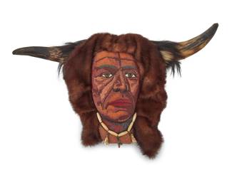 1129 A contemporary Cree beaded buffalo portrait bust wall sculpture Attributed to Jack Little Boy (20th/21st century, Canadian Cree) Untitled, circa 1980s An elaborate portrait worked in polychrome beads on hide, mounted to a partial skull base, featuring a buffalo headdress of buffalo horns, fur, and hide, with a bone necklace and shell dangles, all mounted to a small wood plank board Unmarked Height 11 1/2 in., width 18 in., depth 8 in. Estimate: $300 - $500