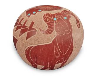1077 Stella & Roy Tanner (Kwa Povi & Tsigowanu) (1937-2006 & b. 1957, San Juan Pueblo) A sgraffito redware pottery jar, 1981 Mounted with turquoise accents Etched signature and date to underside: Tsigowanu / Kwa Povi / 8-3-81 Height 2 in., diameter 2 3/8 in. Estimate: $200 - $300