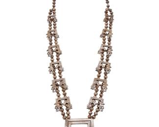 1398 A sandcast silver Rainbow Guardian Yei necklace Attributed to Francis Jones (b. 1943, Diné [Navajo]) A chunky double strand necklace with twelve graduated cast silver Yei figural 'blossoms', suspending a large central cast silver Guardian 'naja' Unmarked 31 1/2 x 2 3/8 in. 208.4 grams Estimate: $400 - $600