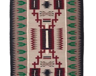 1296 A Diné (Navajo) storm pattern regional rug Late 20th century, attributed to Daisy George, Diné Woven in grey, black, green, red, and white wool, featuring a central storm pattern with hatched zigzag 'lightning' lines and multiple floating elements all within a wide pictorial border with flowering plant motifs and with sawtooth bands to each long side 4 ft. 1 in. x 2 ft. 4 in. approximately Estimate: $300 - $500