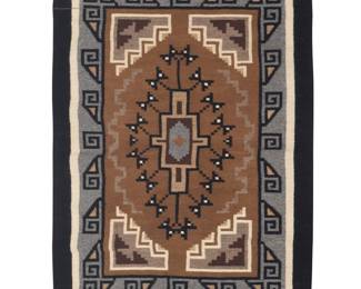 1284 Mary L. Tom (20th/21st century, Diné [Navajo]) A finely woven Two Grey Hills petite rug Worked with a central delicate hooked stepped diamond with stylized butterfly motifs within a complex stepped hooked inner border and banded outer borders, with a spirit line, and all woven in grey, cream, black, and brown wool 2 ft. 9 in. x 1 ft. 11 in. approximately Estimate: $400 - $600