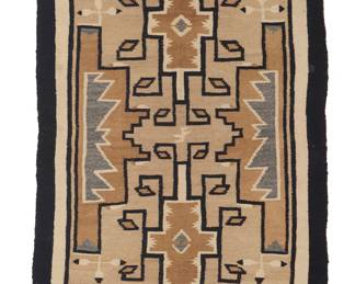 1273 A Diné (Navajo) Two Grey Hills rug Mid-20th century With two central elaborate hooked diamonds flanked by complex stepped motifs with feather motif accents, all with banded borders, finely woven in sand, tan, cream, dark brown, and grey wool with wool warps 4 ft. 5 in. x 2 ft. 5 1/2 in. approximately Estimate: $500 - $700