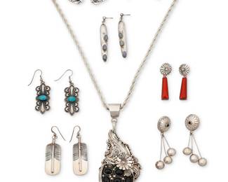 1406 Eight Southwest sterling silver jewelry items Late 20th century Comprising a large sterling silver pendant necklace with cluster set onyx and onyx dangles topped with applied silver feather, floral, and wire accents and suspended on an associated chain (stamped: G), as well as seven pairs of earrings in various styles including a pair of set coral earrings by Herman Vandever (Diné [Navajo]), and a pair of white turquoise drop earrings with stamped edging (likely Elken Senter, Chickasaw), as well as other designs including feathers, set stone dangles, and concho designs Three variously marked for artist: G / ES / [etched signature: Herman Vandever]; five marked for sterling 15 pieces Necklace 24 x 5 1/2 in.; earrings 2 1/2 in. to 1 3/8 in. 178.0 grams gross Estimate: $200 - $400