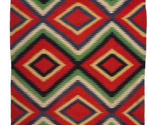 1216 A Diné (Navajo) Germantown weaving Late 19th/early 20th century Woven in red, green, cream, blue, black, and pale yellow wool in an all-over diamond lattice pattern of concentric sawtooth diamond lozenges, with banded ends 7 ft. x 4 ft. 7 in. approximately Estimate: $2,000 - $4,000