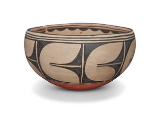 1060 Robert Tenorio (b. 1950, Kewa [Santo Domingo Pueblo]) A large polychrome pottery bowl The interior painted with black corn stalks, the exterior with geometric motifs on white slip ground above a terracotta wash Incised to underside: Robert Tenorio Santo Domingo Pueblo N. Mexico Height 7 5/8 in., diameter 13 7/8 in. Estimate: $500 - $800