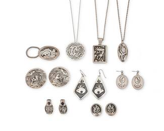 1402 Nine Southwest sterling silver overlay jewelry items Late 20th century A group of Hopi style pictorial and storyteller sterling silver overlay jewelry in various styles including two pendant necklaces and a pendant/brooch, each on an associated chain, as well as five pairs of earrings, and a key ring, with various motifs such as Kokopelli, heartline bear, a lizard, and a Diné weaver, all by various artists including Fernando Puhuhefvaya (Hopi), Dawn Lucas (Hopi), Floyd Becenti, Jr. or Lloyd Becenti (Hopi), E Yazzie (Diné [Navajo]), Wilbur Wauneka (Diné [Navajo]), Les Peone, Gibson Gene (Diné [Navajo] Each variously marked for artist: [stylized cloud] / E. Yazzie [script] / BcT / WW / L. Peone / [peyote bird picto] / [star picto]; eight marked for Sterling 14 pieces Pendants heights 2 1/8 in. H to 1 1/2 in.; earrings 2 1/2 in. to 1 in.; key ring 1 1/4 x 2 1/2 in. 109.3 grams gross Estimate: $200 - $400