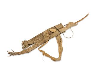 1021 A Hopi bow and four arrows in a hide bow case and quiver Late 19th century Comprising a carved wood and sinew bow, four arrows including one with carved stone tip, most with feather remnants, and a hide quiver and bow cover with fringe 7 pieces Length of bow 52 in.; length of longest arrow 32 3/4 in.; length of bow cover with fringe 46 in. Estimate: $800 - $1,200