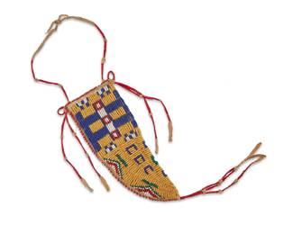 1119 A Plains beaded hide knife sheath Late 19th century A tapered sheath of buffalo hide construction worked on each side in yellow, green, red, blue, and white beads in various geometric motifs, with red quilled hide dangles and strap 6 x 2 1/2 in. (max); tassel 4 1/2 in. Estimate: $1,000 - $1,500