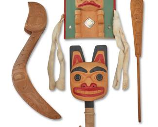 1152 Four Northwest Coast carved wood items Four works:  Mike Epp (b. 1962, Gitlaan/Coast Tsimshian) Comprising three carved wood objects including a polychrome bear rattle with sinew-wrapped handle, a carved polychrome 'Bear' headdress frontlet featuring a standing bear figure, inlaid abalone and bird quill accents, and ermine hide strips, and a long narrow traditional 'soap berry' spoon with a carved eagle motif to one side Each with incised signature: ME [conjoined] 3 pieces Rattle height 10 in., width 4 1/8 in., depth 1 1/2 in.; frontlet height 7 in., width 6 in., depth 1 3/4 in.; spoon height 14 in., width 1 5/8 in., depth 1/4 in.  A large carved wood spoon with eagle-head handle and carved motifs to bowl exterior, circa 1986 Marked to head underside: RH [conjoined] / '86 Height 7 in., width 4 in., depth 13 1/4 in.  4 pieces total Estimate: $500 - $700