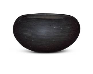 1069 Lucy Martinez (1905-1995, San Ildefonso Pueblo) A blackware pottery bowl With buff glaze Unmarked, attributed by repute Height 6 1/4 in., diameter 10 5/8 in. Estimate: $300 - $500