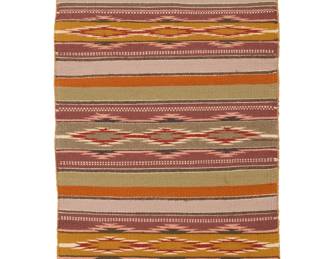 1287 A Diné (Navajo) Wide Ruins textile Late 20th century Woven in multicolor wool, with alternating bands of stacked serrated diamonds 2 ft. 8 in. x 1 ft. 8 in. Estimate: $200 - $400