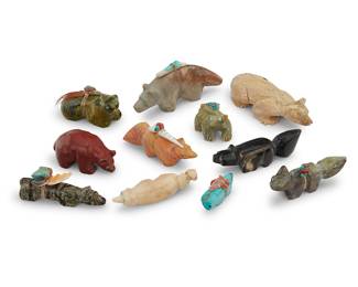 1421 Eleven Zuni carved badger/bear fetishes Mid/late 20th century, mostly Zuni Pueblo From artists including Julie Norton, comprising bears, badgers, and a cougar, most carved from various hardstones, as well as horn, turquoise, sandstone, and pipestone, most with inlaid turquoise eyes, and six mounted with offerings Two variously initialed: SA / NV; one with labels indicating artist 11 pieces Largest height 1 in., width 3 5/8 in., depth 1 3/8 in.; smallest height 3/4 in., width 1 3/8 in., depth 1/2 in. Estimate: $200 - $400