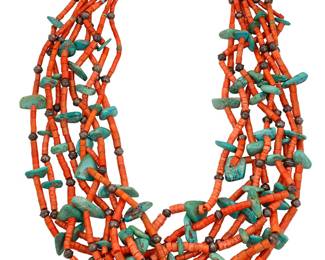 1321 A Pueblo multi-strand necklace Mid-20th century A chunky eight-strand necklace with graduated coral and tab turquoise beads, with silver ball spacers and a traditional wrapped neck cord Unmarked 32 in. approximately 591.1 grams gross Estimate: $800 - $1,200