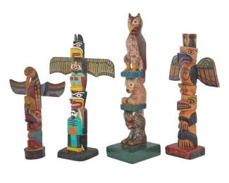 1149 Four Northwest Coast-style polychrome painted totem models First half 20th century The carved painted wood models of varying sizes, featuring stacked figures including eagles, an owl, bears, and a bearded figure The smallest signed and dated in ink to base: Elizabeth Christ / 7-13-28 / Victoria B. C. 4 pieces Largest height 13 3/4 in., width 3 1/2 in., depth 4 in.; smallest height 9 in., width 6 1/4 in., depth 2 1/4 in. Estimate: $200 - $400