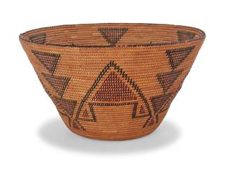 1167 A Yokuts polychrome basketry bowl Early/mid-20th century; Central California The tall coiled tapered basket with five stacked triangular columns alternating with large stepped triangles and contrast diagonal rim stitching Height 6 1/8 in., diameter 11 1/8 in. Estimate: $800 - $1,200