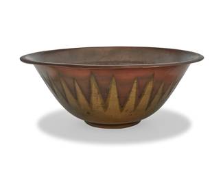 1257 A Roycroft copper and brass fruit bowl 1920s In the Art Deco style Impressed to underside: [orb] / ROYCROFT Height 4 5/8 in., diameter 12 in. Estimate: $500 - $700