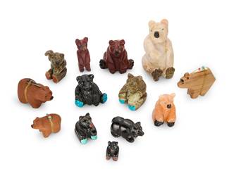 1422 Thirteen Zuni carved bear fetishes Mid/late 20th century, mostly Zuni Pueblo From artists including Nelson Yatsattie, Louise Singer, and Donovan Laiwakete, carved from jet, serpentine, sandstone, pipestone, and wood; one with inset turquoise heartline, three mounted with offerings Some variously incised or inked with signature 13 pieces Largest height 4 in., width 2 in., depth 2 3/8 in.; Smallest height 1 in., width 3/4 in., depth 3/4 in. Estimate: $200 - $400