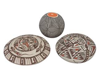 1056 Three Acoma Pueblo pottery items Second half 20th century Three works: Rachel Concho (b. 1936) A polychrome seed pot with all-over Mimbres Revival-style lizards and geometric motifs Signed in slip to base: R. Concho / Acoma, N.M. Height 1 3/4 in., diameter 3 1/8 in. Two polychrome pottery seed pots, including a flat seed pot with a central design of lizards and insects, and a band of geometric motifs to edge, possibly Carolyn Concho (b. 1963, Acoma), together with a globular miniature fine line seed jar with red base and top Variously marked in slip to base: C. Concho, Acoma, N.M. / MH Acoma N.M 2 pieces Larger height 1 1/2 in., diameter 3 5/8 in; smaller height 2 1/8 in., diameter 2 1/4 in. 3 pieces total Estimate: $200 - $400