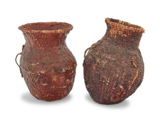 1175 Two Apache pitch-covered basketry vessels Late 19th/early 20th century; Southwest United States Comprising two coiled basketry jars, each with basketry twig handles, and each coated in pine pitch 2 pieces Larger height 10 in., width 8 1/2 in., depth 5 3/4 in.; smaller height 9 1/2 in., width 7 1/2 in., depth 7 in. irregular Estimate: $200 - $400