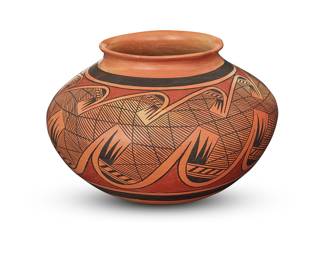 1032 Fannie Polacca Nampeyo (1900-1987, Hopi) A polychrome pottery jar With red and black band of migration pattern motif around body Signed in slip to underside: FANNIE NAMPEYO Height 6 1/2 in., diameter 10 in. Estimate: $1,500 - $2,500