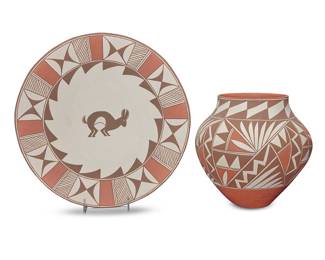 1055 Loretta Joe (b. 1958, Acoma Pueblo) Two polychrome pottery items Comprising a plate with red and brown band of geometric motifs to rim centering a hare, and an olla jar with red and brown geometric motifs, each on white slip ground Each signed in slip to underside: L. JOE / ACOMA / N.M. 2 pieces Height of olla 9 1/2 in., diameter 10 1/4 in.; height of plate 1 1/2 in., diameter 15 1/8 in. Estimate: $400 - $600