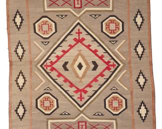 1222 A Diné (Navajo) Crystal JB Moore rug First half 20th century Woven in grey, tan, red, cream, brown, and olive green wool with wool warps, featuring a central elaborate diamond flanked by stylized cross motifs, with multiple floating motifs including whirling logs, and a wide border with stepped diamonds, a J.B. Moore variant of Plate XXX 6 ft. 10 in. x 4 ft. 2 in. approximately Estimate: $800 - $1,200