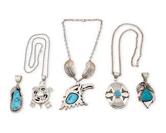 1353 Five Southwest sterling silver pendants Late 20th/21st century Comprising a large shadowbox-style cutout silver eagle head profile pendant necklace with large set turquoise suspended from a silver chain with feather links, by Delbert Vandever (Diné [Navajo]), a concho-style silver overlay pendant with set turquoise on a chain, by Norman Woody (Diné [Navajo]), as well as a cutout silver turtle pendant/brooch on a silver chain, and two chunky silver and set turquoise pendants, each with elaborate applied silver feather and wire accents Variously marked for artist: N. Woody / LB Toledo [Thunderbird, for Les Baker shop] / SV; each marked for sterling 5 pieces Eagle 16 1/2 x 2 1/2 in.; pendants 3 1/8 to 3 in.; chains 24 in. & 21 1/2 in. 189.8 grams gross Estimate: $400 - $600