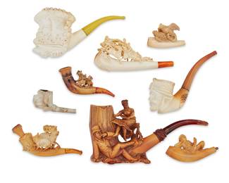 1198 A group of nine meerschaum pipes Late 19th/early 20th century Each pipe bowl carved in intricate high relief with various figures, portrait masks, and animal groups including deer, dogs, and birds, five with attached stems, and four with fitted cases 13 pieces Largest height 4 in., width 8 in., depth 2 in.; smallest height 1 1/2 in., width 3 in., depth 1 in.; largest case height 3 in., width 8 in., depth 1 1/4 in. Estimate: $500 - $800