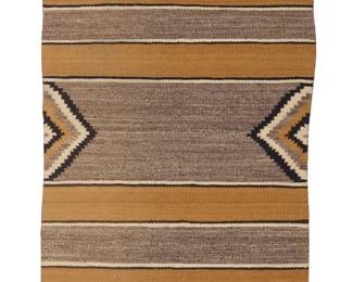 1280 A Diné (Navajo) double saddle blanket Mid/late 20th century The long blanket woven in cream, black, ochre, and mottled grey wool with wide ochre bands alternating with grey bands, and with concentric stepped diamonds to central edges and corners 4 ft. 1 1/2 in. x 2 ft. 6 1/2 in. approximately Estimate: $200 - $300