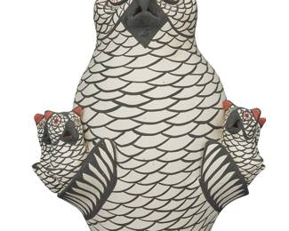 1044 Anita Candelaria (20th century, Zuni Pueblo) A polychrome pottery owl storyteller, late 20th/early 21st century With red and black painted designs on white slip ground Signed in slip to underside: ANITA CANDELARIA / ZUNI, N.M Height 10 3/8 in., width 7 3/4 in., depth 5 7/8 in. Estimate: $200 - $400