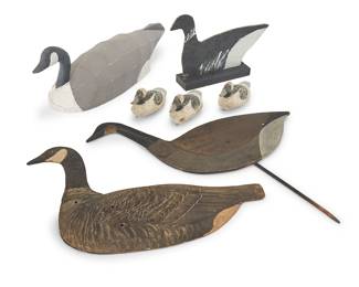 1241 Seven Folk Art geese patio ornaments Mid/late 20th century Canvas duck impressed to underside: SPORT EN ART; and signed: by Ron Vich Comprising three painted carved wood cygnet decoys, one painted wood panel in wood base, one painted wood with metal articulated neck, one printed board with articulated neck, and one painted canvas, armature, and wood decoy 7 pieces Height of canvas 9 7/8 in., width 26 5/8 in., depth 9 1/4 in.; height of cygnet decoys 4 3/4 in., width 9 1/2 in., depth 4 1/2 in. Estimate: $300 - $500