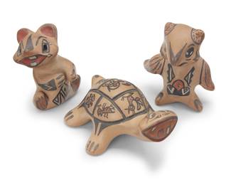 1074 Margaret & Luther Gutierrez (1936-2017 & 1911-1987, Santa Clara Pueblo) Three polychrome pottery figures Decorated in multicolor slip on cream ground Each signed in slip to underside: Margaret / Luther 3 pieces Height of tallest 3 3/8 in., width 2 3/4 in., depth 2 in.; height of shortest 2 1/4 in., width 4 in., depth 3 1/8 in. Estimate: $200 - $300