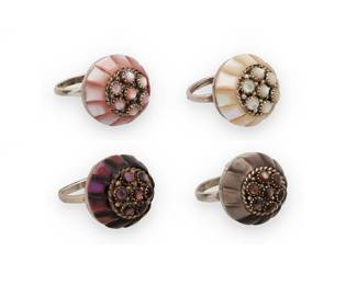 1338 Lee & Mary Weebothee (1927-2015 & 1934-1995, Zuni Pueblo) Four sterling silver domed rings, each cluster-set with cobblestone inlay in mother of pearl and shell in various colors including purple, pale purple/gray, pink, and white Each stamped: Lee/Mary [script] / Zuni 4 pieces Ring sizes 7 1/2 to 5 24.3 grams gross Estimate: $400 - $600