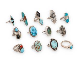 1416 Thirteen Southwest sterling silver and set stone rings Mid/late 20th century A large group of rings, most with various set stones including turquoise, coral, green hardstone, mother of pearl, and chipped stone inlay, and one with silver wire and feather overlay accents, by various artists including Melton Lee (Diné [Navajo]), and L. Spencer (possibly Lorraine Spencer, Diné [Navajo] Four marked for artist; four marked for Sterling 13 pieces Ring sizes 10 to 5 80.2 grams gross Estimate: $300 - $500