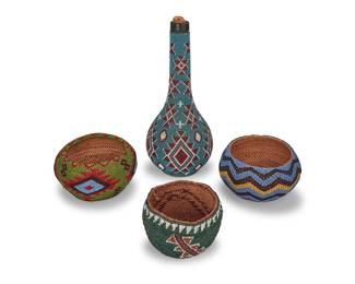 1166 Four Western polychrome beaded basketry items First half 20th century Comprising two small Paiute coiled beaded baskets, one with repeating zigzag bands, the other with serrated diamond elements, as well as a Klamath twined basket in green with three diagonal sawtooth motifs; and a Modoc bead-overlaid bottle decorated with serrated diamonds and crosses 4 pieces Paiute height 3 in., diameter 5 3/8 in.; Klamath height 2 3/4 in., diameter 4 1/4 in.; bottle height 10 3/4 in., diameter 4 1/2 in. approximately Estimate: $1,200 - $1,800