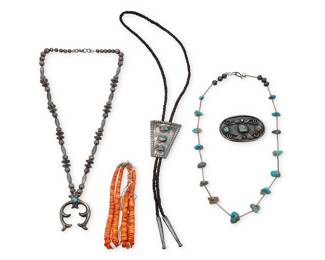 1331 Five Southwest jewelry items Mid-20th century Comprising a sterling silver necklace with a set turquoise and cast silver naja and a sterling silver and set turquoise bolo tie, as well as a Pueblo-style liquid silver and turquoise tab necklace, a pair of spiney oyster jaclas, and a sterling silver belt buckle with set turquoise and applied silver wire and feather accents Each unmarked 5 pieces Necklaces 25 x 2 1/4 in. & 24 in.; bolo 2 3/8 x 1 3/4 in., cord 36 in.; jaclas 5 3/8 in.; buckle 1 3/4 x 2 5/8 in. 212.6 grams gross Estimate: $300 - $500