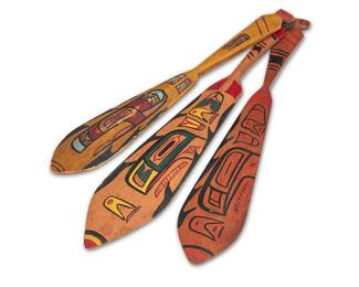 1142 Three Salish polychrome painted paddles Mid-20th century; Pacific Northwest The oar-shaped carved wood women's dance paddles each with painted motifs to one side and to handle Largest 20 x 3 3/4 in.; smallest 17 1/2 x 3 in. Estimate: $500 - $700