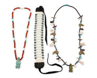1325 Three Southwest necklaces Second half 20th century Comprising a heishi necklace with carved turquoise and stone fetish animals including heartline bears, wolves and birds, with trade beads and animal bone spacers, a necklace of red aventurine stone beads with bone and turquoise spacers and a carved turquoise bear fetish pendant, and a bone and greenstone beaded choker necklace with black hide laces 3 pieces Necklace lengths 33 in. to 14 1/2 in. (plus laces) 324.6 grams gross Estimate: $200 - $400