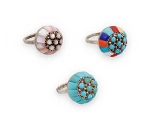 1337 Lee & Mary Weebothee (1927-2015 & 1934-1995, Zuni Pueblo) Three sterling silver and set stone domed rings, each cluster-set with cobblestone inlay, including one with turquoise, one with pink mother of pearl shell inlay, and one with multistone inlay including coral, turquoise, mother of pearl, shells, and lapis lazuli Each stamped: Lee/Mary [script] / Zuni 3 pieces Ring sizes 7 3/4 to 6 19.8 grams gross Estimate: $400 - $600